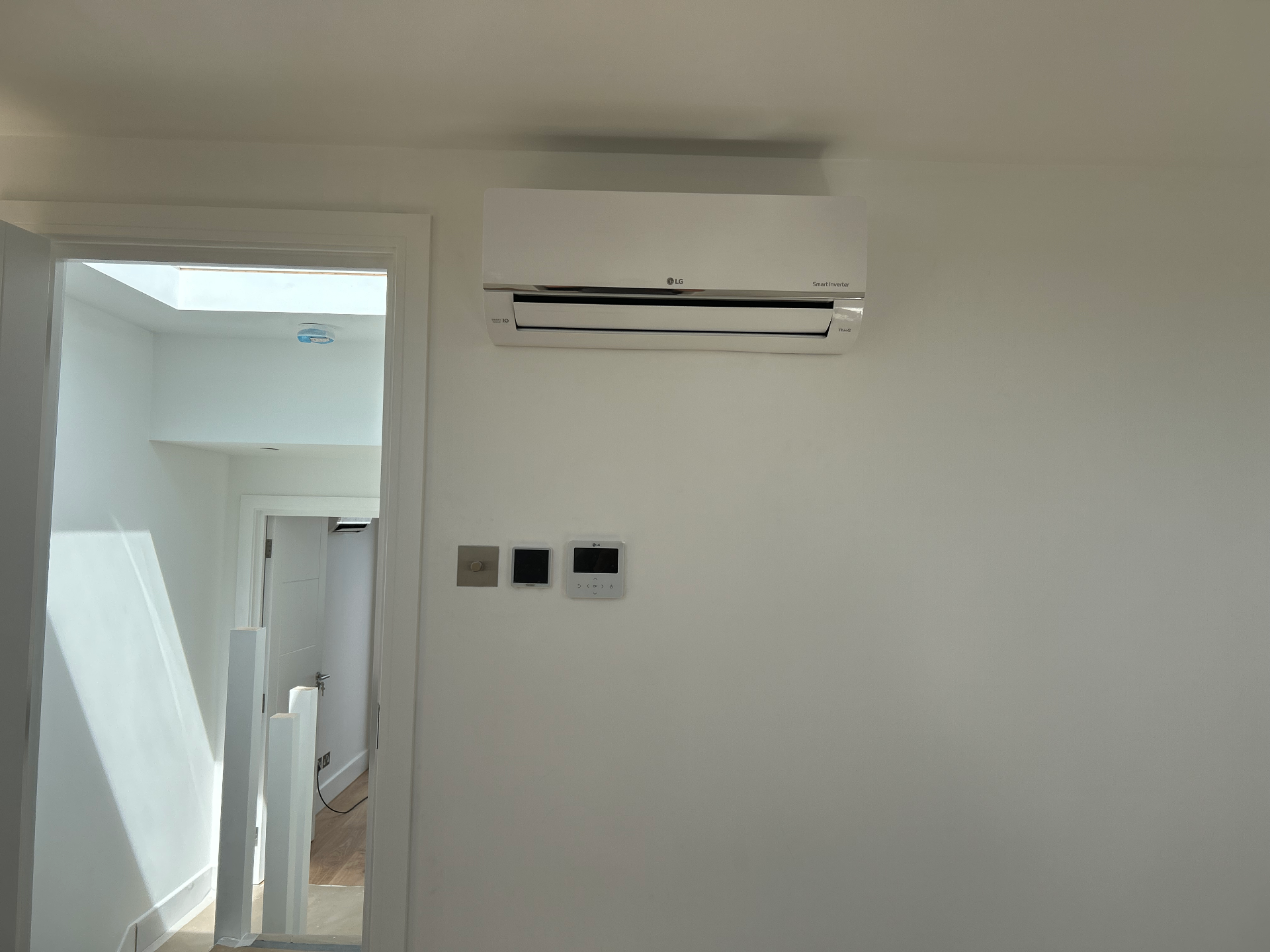 LG wall-mounted air conditioning unit installed on a clean white wall in a Richmond home