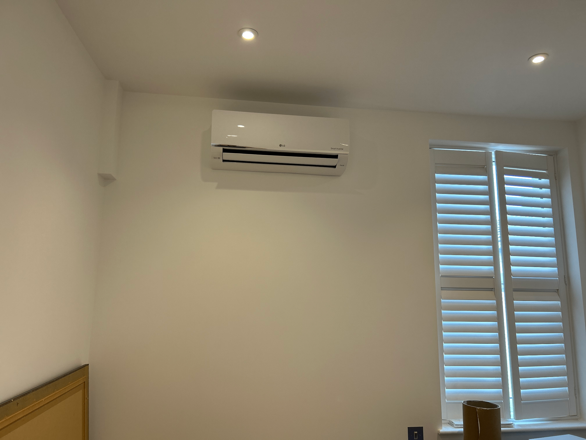 New LG Smart Inverter wall-mounted air conditioning unit in protective wrapping after installation in Richmond