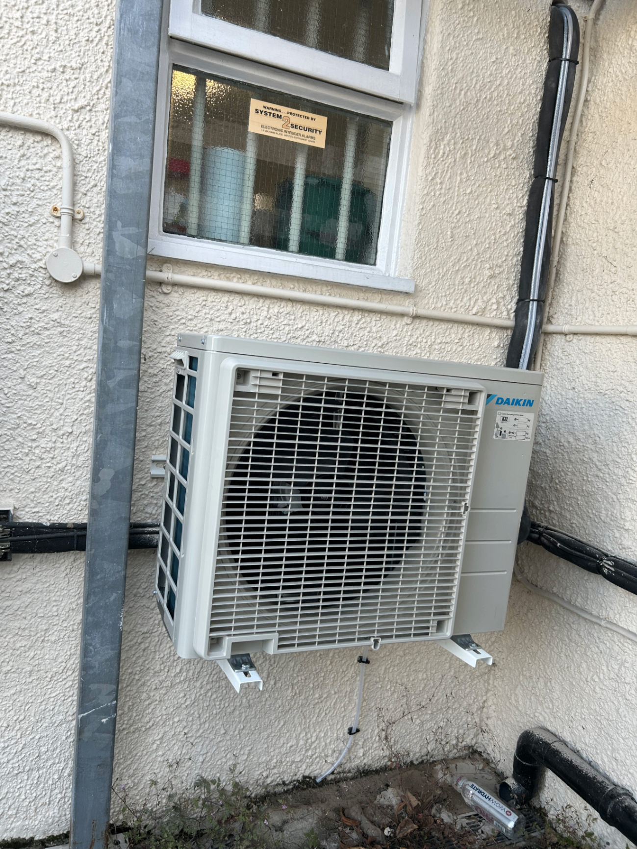 Daikin outdoor air conditioning condenser wall-mounted on a Wandsworth property exterior